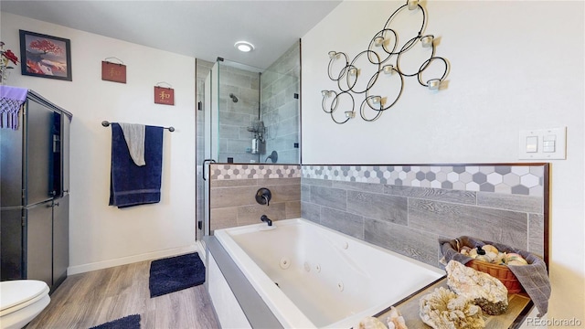 40291 Gold Nugget Dr, Deer Trail, CO 80105 - full bath with a shower stall, a whirlpool tub, and wood finished floors