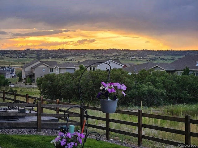 view of property's community with a residential view and fence