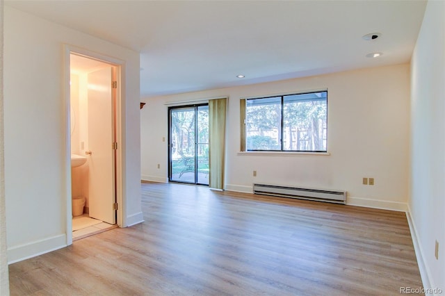 1172 Juniper Ave, Boulder, CO 80304 - spare room featuring a baseboard heating unit, light wood finished floors, and recessed lighting