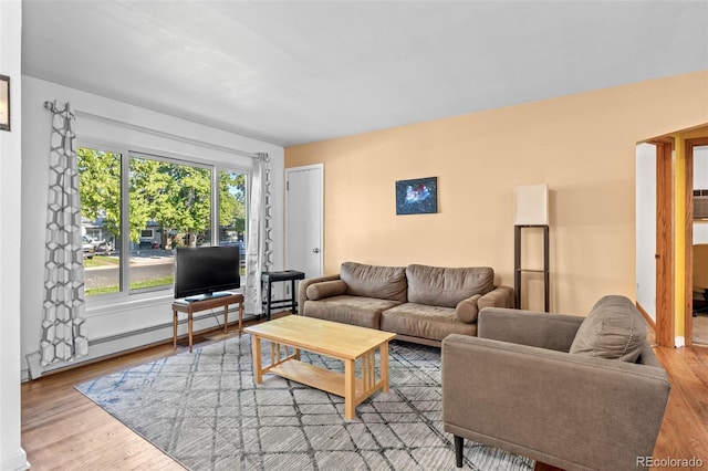 1732 Lansing St, Aurora, CO 80010 - living area featuring wood finished floors and baseboard heating