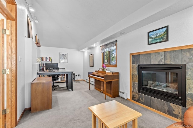 1732 Lansing St, Aurora, CO 80010 - home office featuring lofted ceiling, baseboard heating, a tile fireplace, carpet, and a baseboard radiator