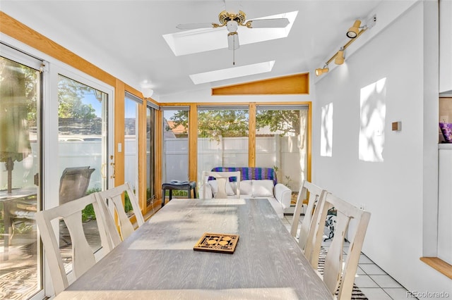 1732 Lansing St, Aurora, CO 80010 - sunroom / solarium with a skylight, plenty of natural light, lofted ceiling, and tile patterned floors