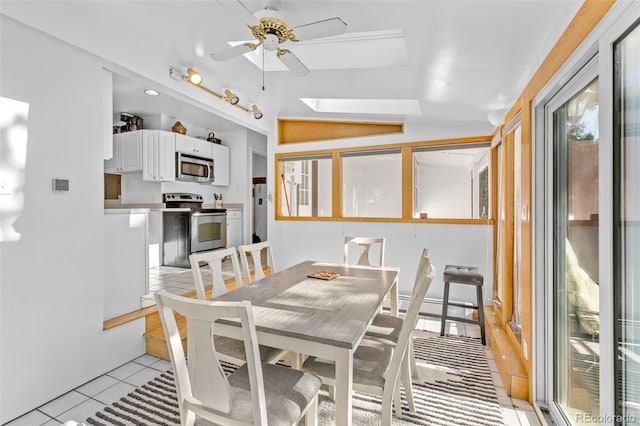 1732 Lansing St, Aurora, CO 80010 - dining space with ceiling fan, light tile patterned floors, and a skylight