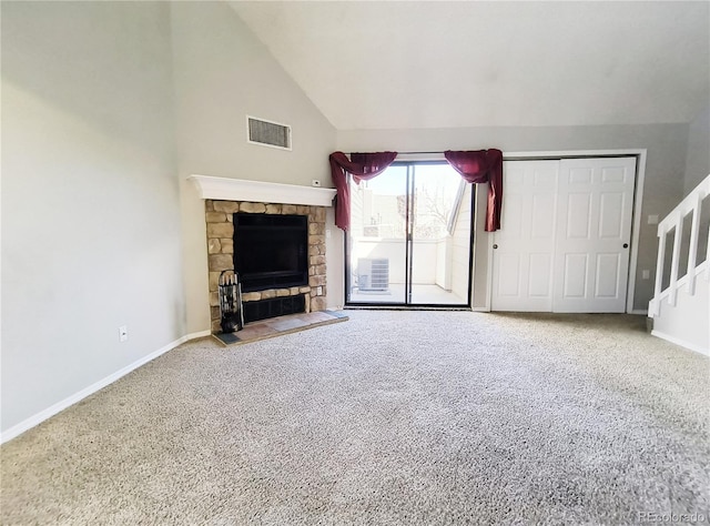 unfurnished living room with visible vents, a fireplace, baseboards, and carpet floors