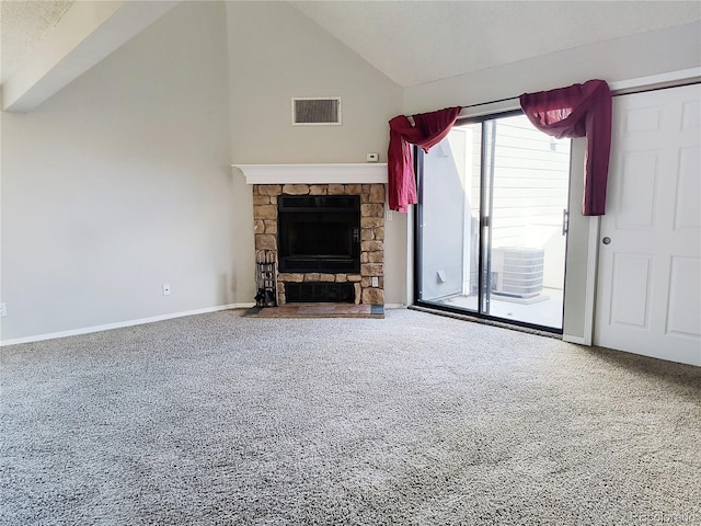 unfurnished living room with carpet, visible vents, baseboards, high vaulted ceiling, and a stone fireplace