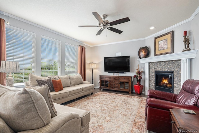 13326 Olive Way, Thornton, CO 80602 - living room featuring ornamental molding, a ceiling fan, a fireplace, baseboards, and recessed lighting