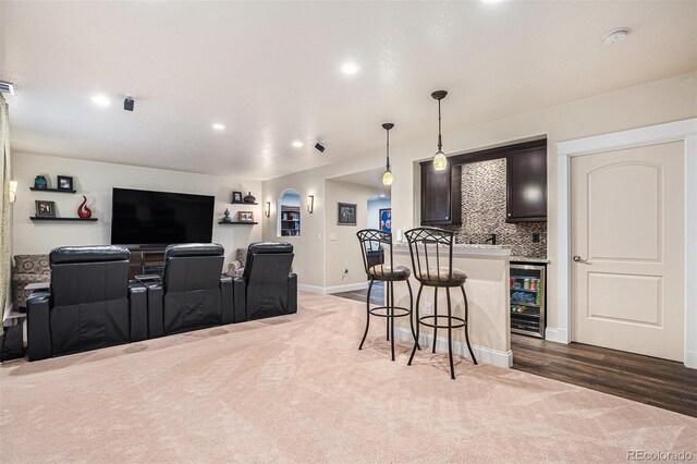 13326 Olive Way, Thornton, CO 80602 - interior space with beverage cooler, carpet floors, arched walkways, bar area, and recessed lighting