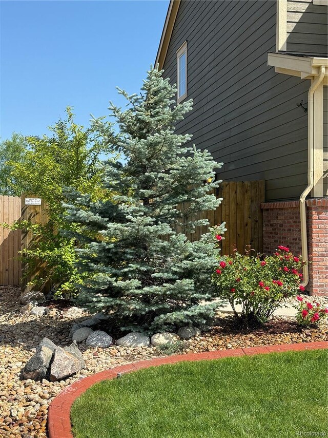 13326 Olive Way, Thornton, CO 80602 - view of property exterior featuring brick siding