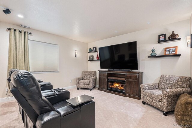 13326 Olive Way, Thornton, CO 80602 - carpeted living room with a glass covered fireplace and baseboards