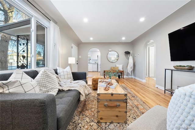 living room with hardwood / wood-style floors and plenty of natural light