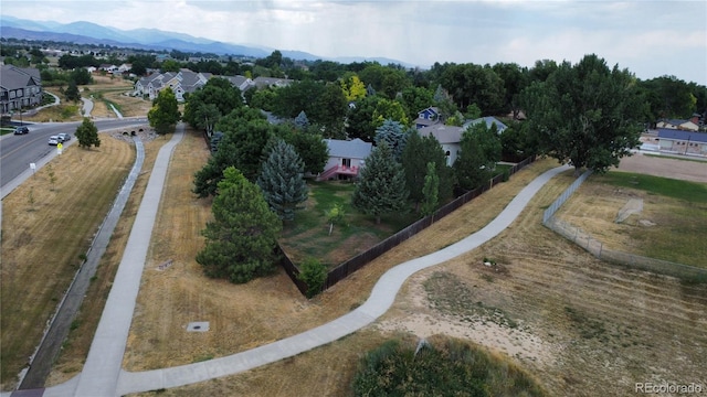 birds eye view of property with a mountain view