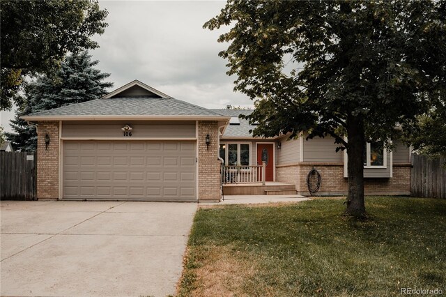 single story home with a garage and a front yard