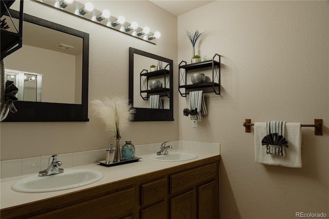 bathroom with dual vanity