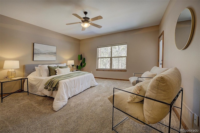 bedroom featuring baseboards, carpet floors, visible vents, and a ceiling fan