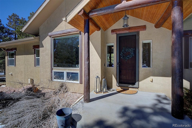 doorway to property with stucco siding