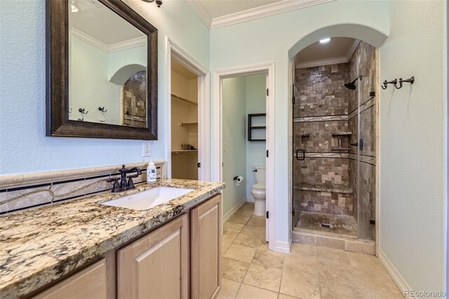 10127 Bluffmont Ln, Lone Tree, CO 80124 - bathroom with crown molding, a shower stall, vanity, and tile patterned floors