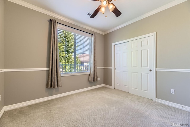10127 Bluffmont Ln, Lone Tree, CO 80124 - unfurnished bedroom with ornamental molding, light colored carpet, a closet, and ceiling fan