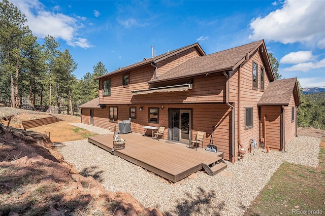 44 Conestoga Ct, Bailey, CO 80421 - back of property featuring a deck and roof with shingles