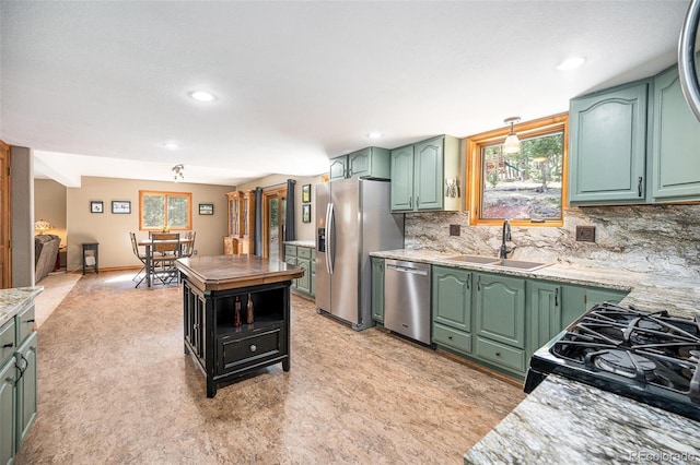 44 Conestoga Ct, Bailey, CO 80421 - kitchen with stainless steel appliances, green cabinetry, a sink, healthy amount of natural light, and recessed lighting