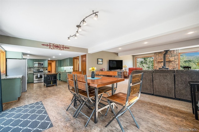 44 Conestoga Ct, Bailey, CO 80421 - dining area with a wood stove and recessed lighting