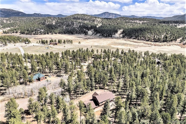44 Conestoga Ct, Bailey, CO 80421 - aerial view of property and surrounding area with mountains and a heavily wooded area