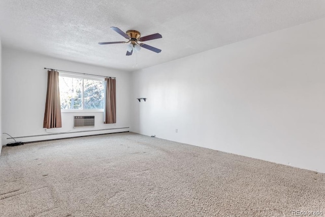 carpeted empty room with ceiling fan, a baseboard heating unit, a wall unit AC, and a textured ceiling