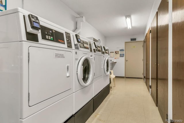 clothes washing area featuring washer and dryer