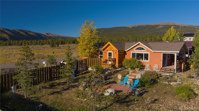 exterior space with a patio area and a mountain view