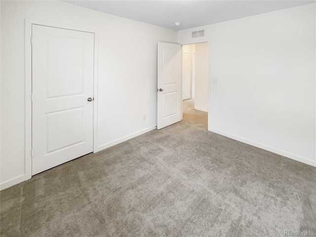 unfurnished bedroom with light colored carpet