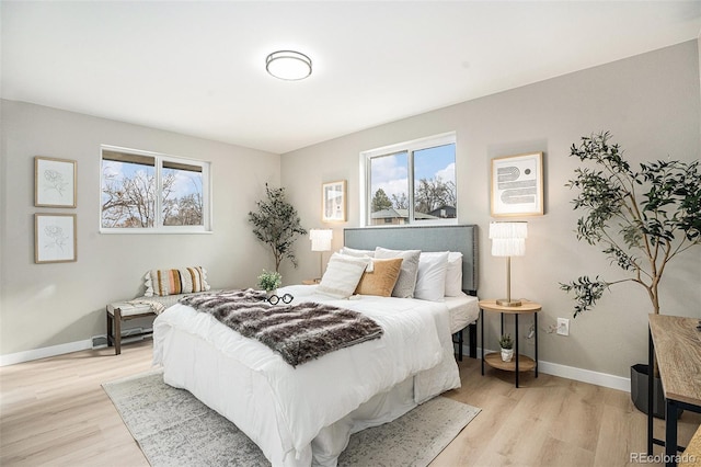 bedroom with light wood-type flooring