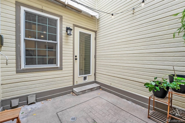 doorway to property with a patio