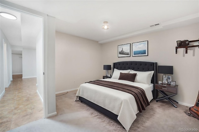 bedroom with visible vents and baseboards