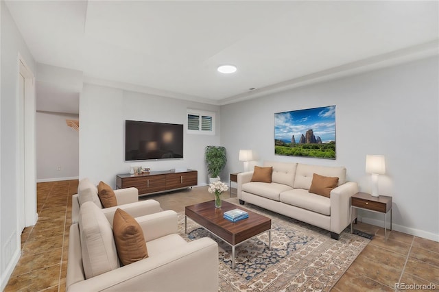 living area with baseboards and recessed lighting