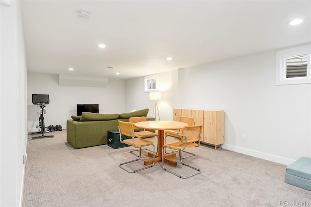 dining space featuring recessed lighting, baseboards, and light colored carpet