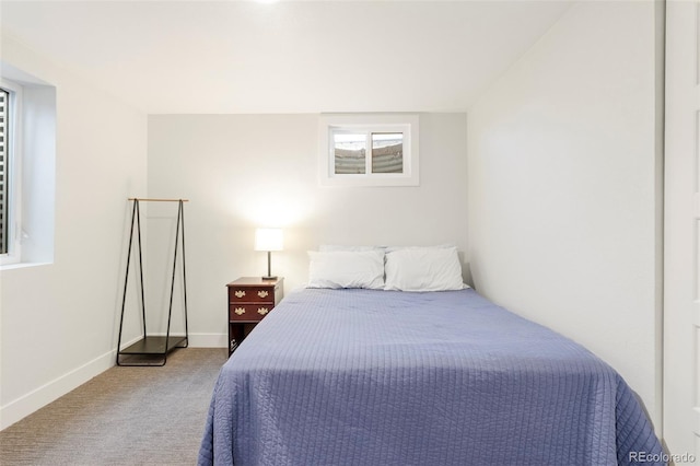 bedroom featuring carpet floors and baseboards