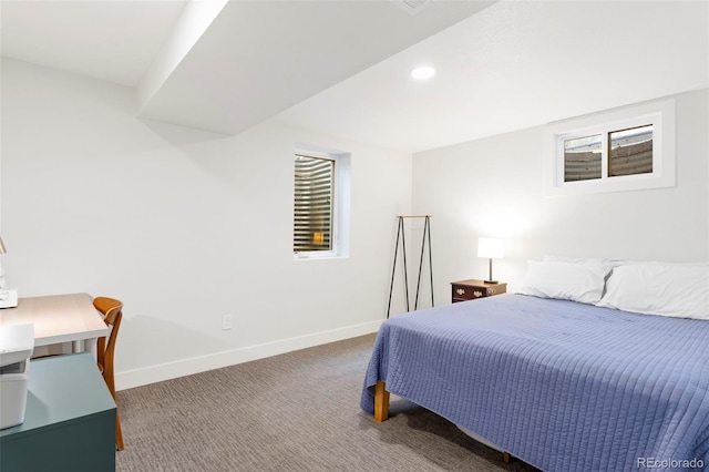 carpeted bedroom featuring baseboards and recessed lighting