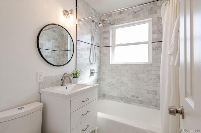 bathroom with vanity, toilet, and shower / bath combo