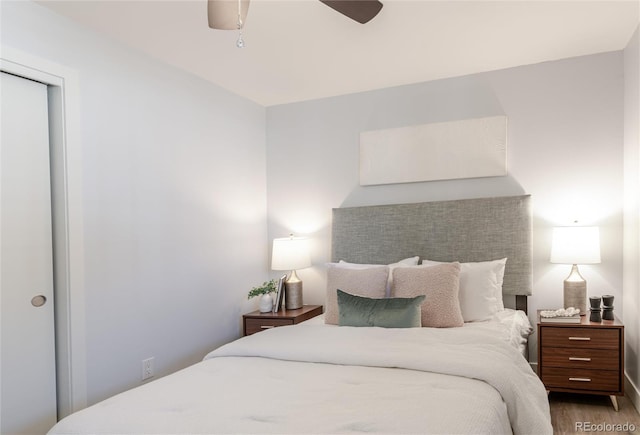 bedroom featuring wood finished floors and ceiling fan