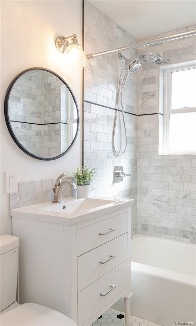 full bathroom with shower / bathtub combination, toilet, and vanity