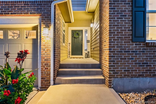 view of exterior entry with brick siding