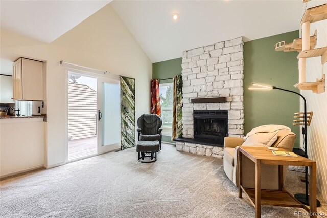 461 S Kalispell Way Unit D, Aurora, CO 80017 - living area featuring carpet floors, a fireplace, and high vaulted ceiling