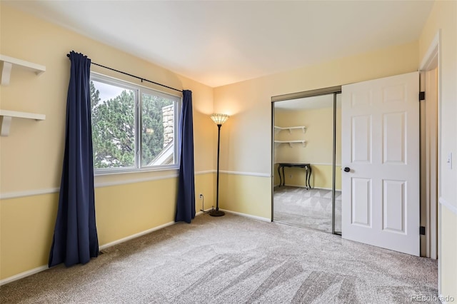 461 S Kalispell Way Unit D, Aurora, CO 80017 - unfurnished bedroom featuring carpet flooring and a closet