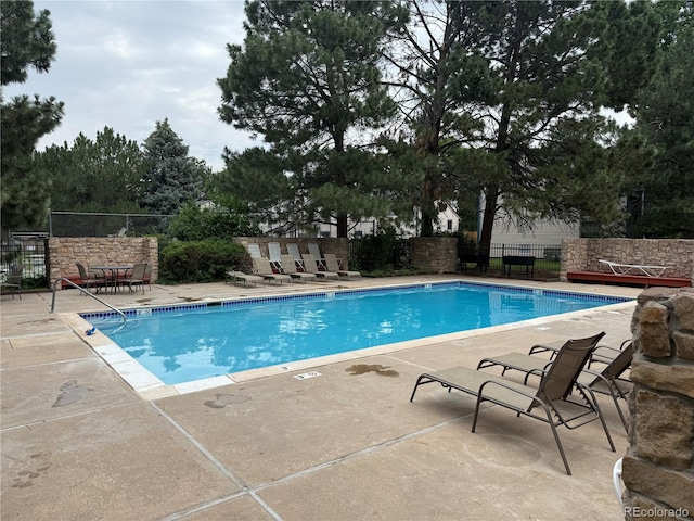 461 S Kalispell Way Unit D, Aurora, CO 80017 - community pool featuring a patio