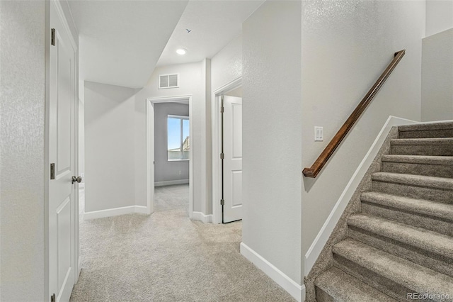 9374 Quartz St, Arvada, CO 80007 - hallway featuring light colored carpet, stairs, baseboards, and recessed lighting