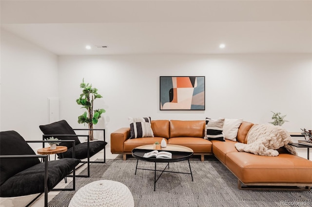 living room with recessed lighting and visible vents