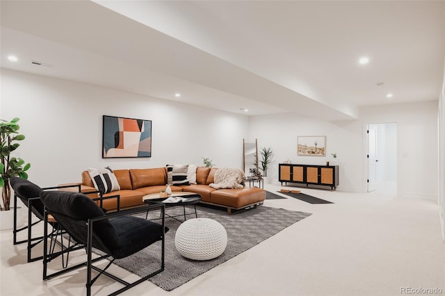 living area featuring recessed lighting, visible vents, baseboards, and light colored carpet