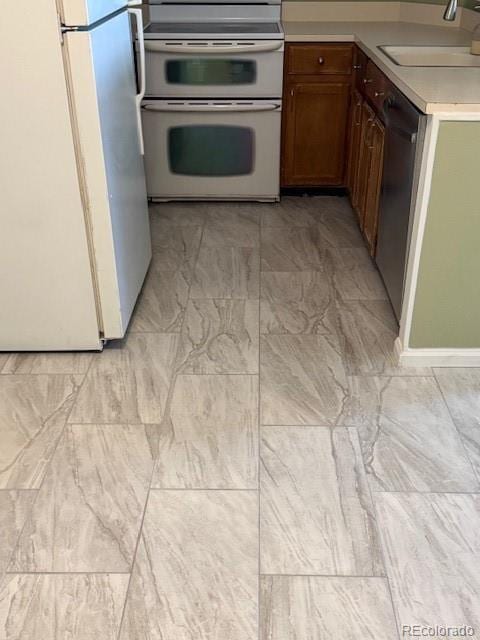 kitchen with sink and white appliances