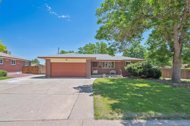1774 S Dover Way, Lakewood, CO 80232 - ranch-style home with driveway, an attached garage, and brick siding
