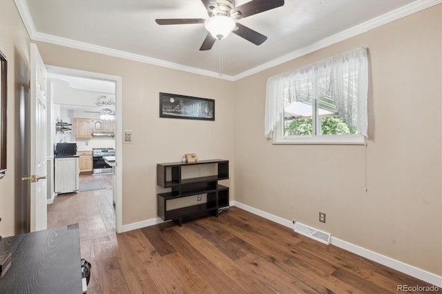 1774 S Dover Way, Lakewood, CO 80232 - spare room featuring ceiling fan, ornamental molding, and wood finished floors