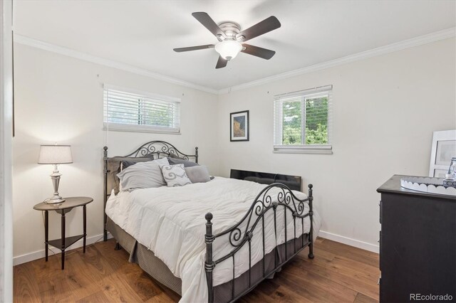 1774 S Dover Way, Lakewood, CO 80232 - bedroom featuring ornamental molding, wood finished floors, and a ceiling fan